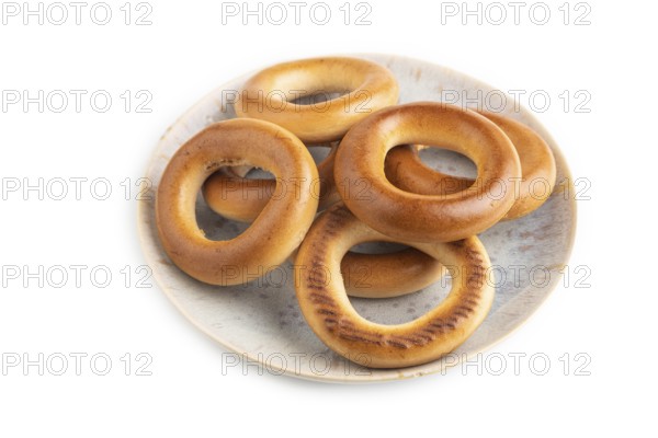 Homemade Ring Bagel isolated on white background. side view, close up