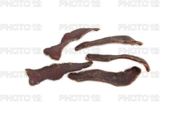 Armenian Basturma dried meat isolated on white background. Side view, flat lay