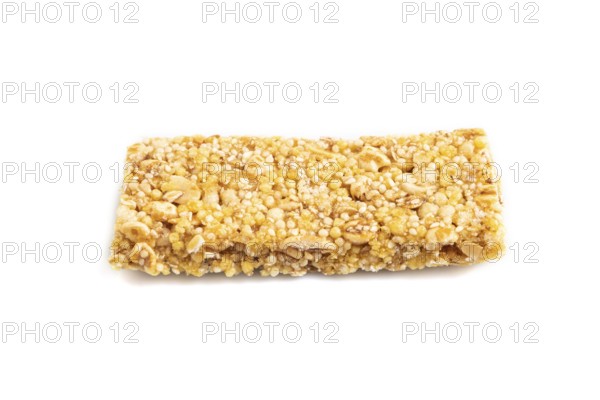 Granola bar with, caramel, nuts, flakes isolated on white background. Side view, close up