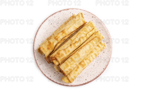 Waffles with caramel isolated on white background, top view, flat lay, close up