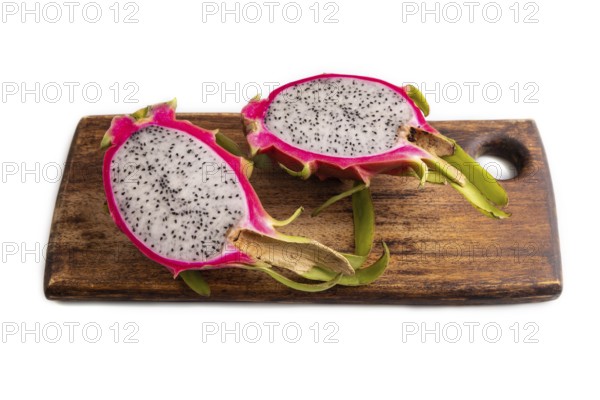 Ripe Pitaya on cutting board isolated on white background, side view, close up, minimalism