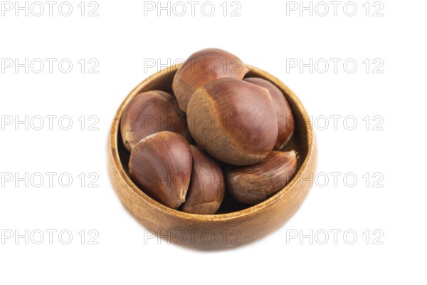 Wooden bowl with raw edible ?hestnuts Isolated on white background, side view, close up, minimalism