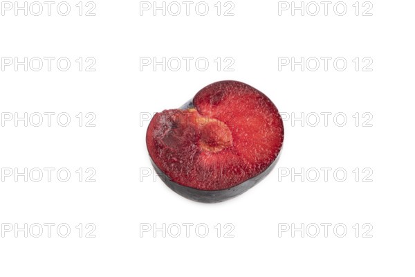 Purple Plum Cut in half isolated on white background. Side view, copy space. healthy food, vegetable, minimalism
