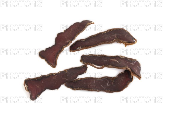 Armenian Basturma dried meat isolated on white background. Top view, flat lay