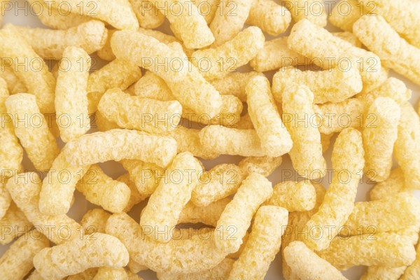 Corn flakes sticks with caramel isolated on white background. top view, flat lay, close up