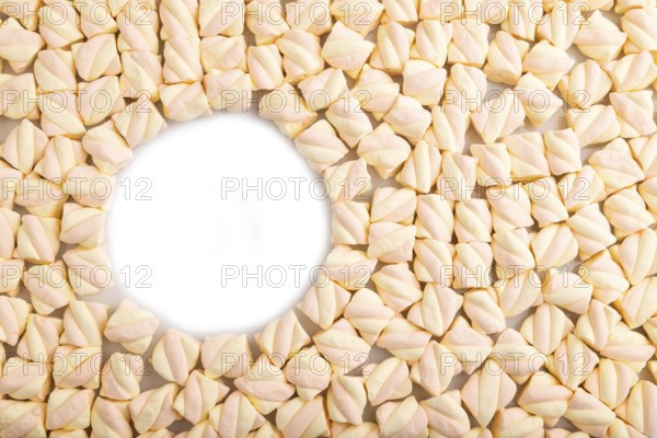 Round copy space on Orange and pink marshmallow background, top view, flat lay, minimalism