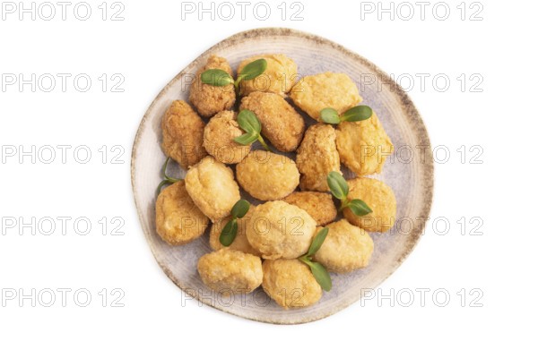 Fried crispy Chicken Nuggets with ketchup, microgreen isolated on white background. top view, flat lay, close up