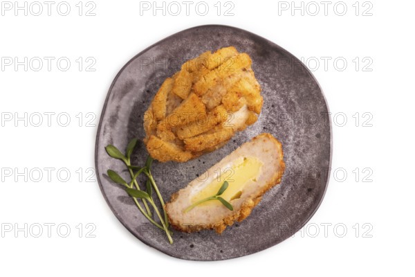 Chicken Schnitzel on gray plate with microgreen Isolated on white background. top view, flat lay, copy space