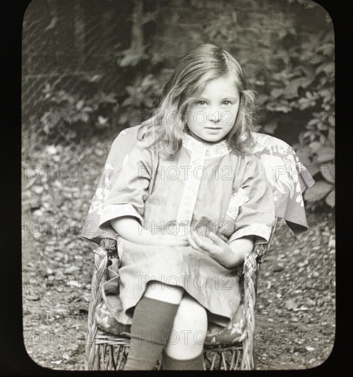 Magic lantern slide c 1900-1910 halftone portrait of pretty young girl sitting in a chair