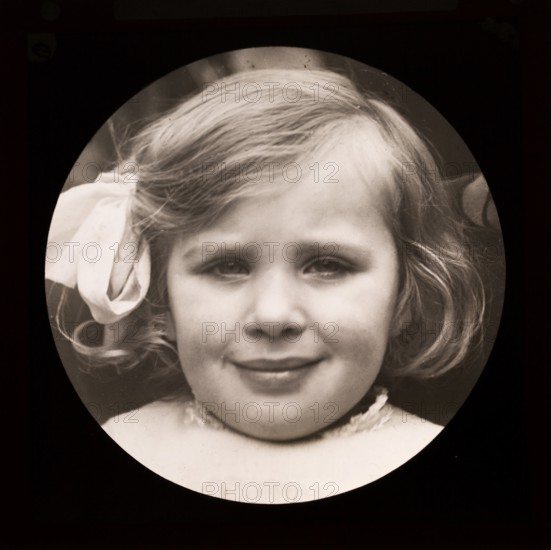 Halftone portrait close up photograph of young girl looking at camera c 1900