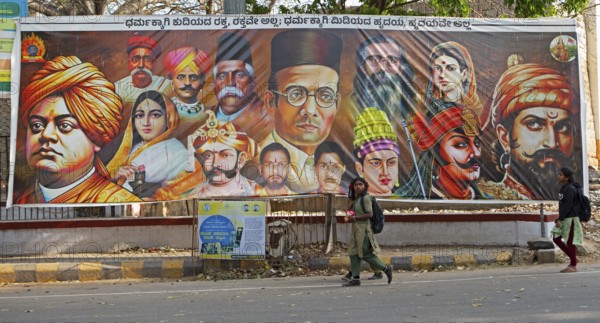Street poster with the heads of religious fighters for Hinduism, Srirangapatna, Karnataka, India