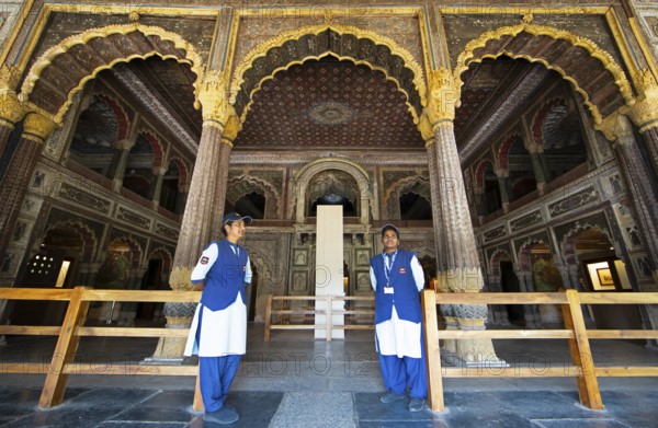 Indian woman guarding the Daria Daulat Bagh or Tipu Sultan's summer palace, Srirangapatna, Karnataka, India