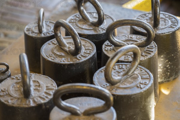 Close-up of old metal weights used in traditional cheese scales, former city scales, cheese market, Alkmaar, Alkmar, Noord-Holland, North Holland, Netherlands