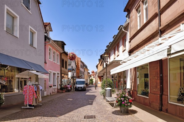 Ettlingen, Germany - August 13th 2025: City street in Ettlingen city center with boutiques and shopping on a sunny summer day