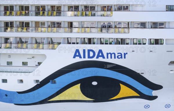 Close-up of an AIDA cruise ship with balconies and striking blue and yellow livery, Warnemünde, Rostock, Mecklenburg-Western Pomerania, Germany