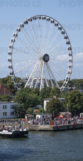 Large Ferris wheel on the waterfront promenade, Warnemünde, Rostock, Mecklenburg-Vorpommern, Germany