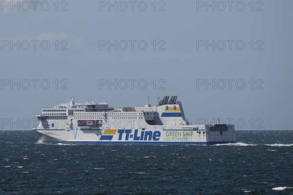 LNG-powered TT-Line ferry travelling across a gently moving blue sea, near Warnemünde, Rostock, Mecklenburg-Vorpommern, Germany