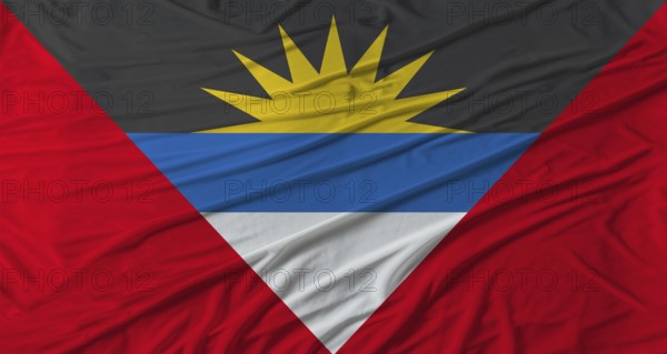 Antiguan flag waving. Flag of Antigua and Barbuda with cloth texture