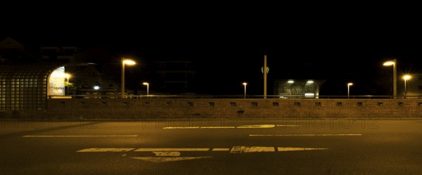 View across the street to the city railway station Stadtfriedhof Stöcken at night, Stöcken, Hanover, Lower Saxony, Germany