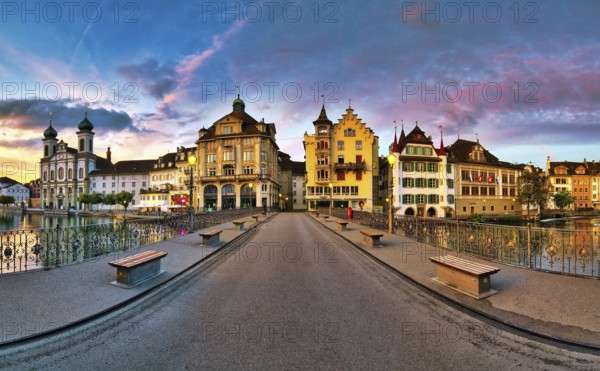 View of Lucerne's old town with Jesuit church from the Reuss bridge at dawn, Canton of Lucerne, Switzerland