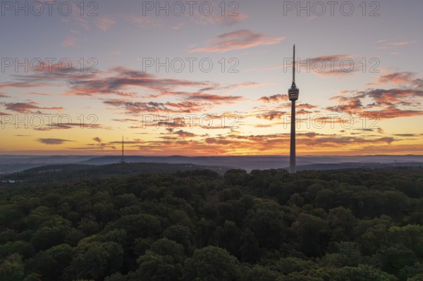 TV tower at dawn with dramatic clouds over forested area, Stuttgart-Degerloch, Baden-Württemberg, Germany