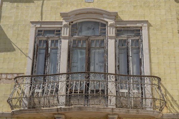 Facade of buildings decorated with tiles, azulejos, coloured tiles on facades, in Tavira, old town, in the east of the Algarve, Portugal