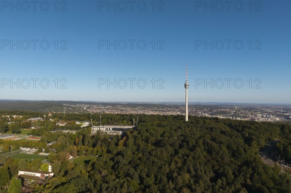 Impressive view over a green forest landscape with a striking television tower and a city in the background, Gazi Stadium, Stuttgart, Baden-Württemberg, Germany
