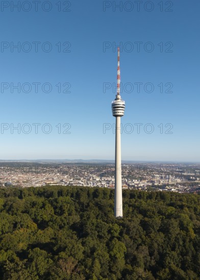 View of a television tower above a forest with a cityscape behind it, Stuttgart, Baden-Württemberg, Germany