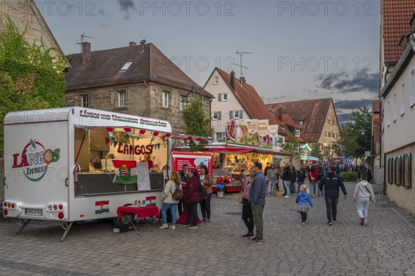 Show shops in the evening at the parish fair in the village of Eschenau, Middle Franconia, Bavaria, Germany