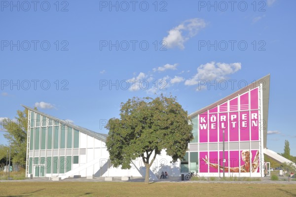Multipurpose hall Hyparschale, Modern building, Inscription, Body Worlds, Banner, Rotehorn, City Park, Rotehornpark, Magdeburg, Saxony-Anhalt, Germany