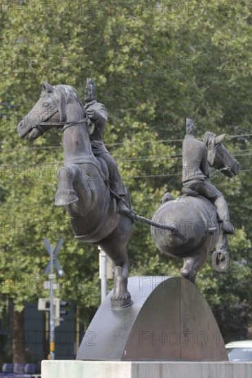Magdeburg hemispheres by Thomas Virnich 2012, monument to physicist and mathematician Otto von Guericke, two half equestrian figures pull halved sphere apart, half, halved, inventor, vacuum, symbol, force, strength, separate, struts, inside, landmark, Council Coat of Arms Square, Magdeburg, Saxony-Anhalt, Germany