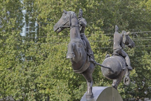 Magdeburg hemispheres by Thomas Virnich 2012, monument to physicist and mathematician Otto von Guericke, two half equestrian figures pull halved sphere apart, half, halved, inventor, vacuum, symbol, force, strength, separate, struts, inside, landmark, Council Coat of Arms Square, Magdeburg, Saxony-Anhalt, Germany