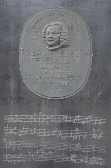 Telemann stele with relief of the composer Georg Philipp Telemann, inscription, bronze, text, memorial plaque, musical notes, score, musical notation, Telemann stele, Magdeburg, Saxony-Anhalt, Germany