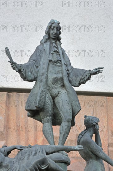 Telemann and the four temperaments by Eberhard Roßdeutscher 1981, monument to composer Georg Philipp Telemann, arms, gestures, scroll, standing, bronze sculpture, modern art, Telemann monument, Magdeburg, Saxony-Anhalt, Germany