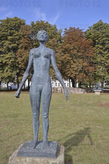 Sculpture The Swimmer by Jenny Mucchi-Wiegmann 1968, modern art, bronze sculpture, life-size, standing female figure, sculpture park, Magdeburg, Saxony-Anhalt, Germany