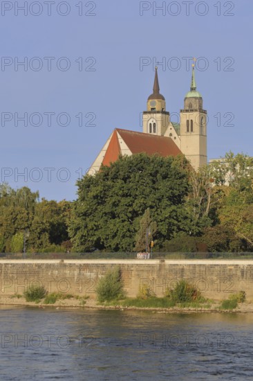 Late Romanesque St John's Church with twin towers on the banks of the Elbe, Magdeburg, Saxony-Anhalt, Germany
