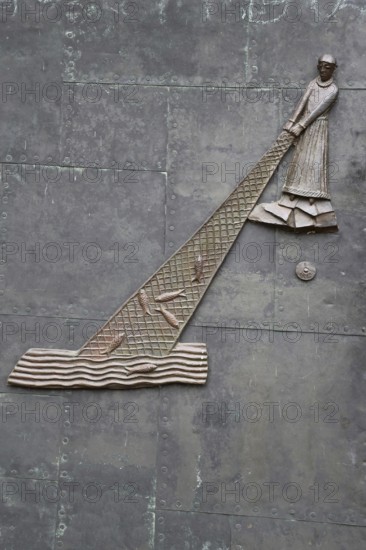 Relief with fisherman with fishing net in water at the church door, biblical parable, biblical passage, biblical quotation, Matthew 13. 47-50, symbol, sea, fishing, fish, kingdom of heaven, St Peter's, church, Magdeburg, Saxony-Anhalt, Germany