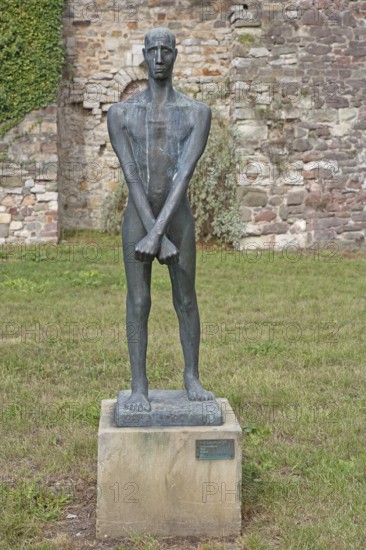 Sculpture Freedom Fighter by Fritz Cremer 1947, sculpture park, standing male figure with arms crossed, one above the other, crosswise, bronze sculpture, life-size, Kloster Unser Lieben Frauen, art museum, Magdeburg, Saxony-Anhalt, Germany