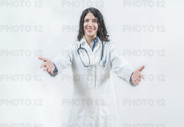 Doctor smiling with open arms welcoming. Friendly doctor hugging the camera. Medical friendship concept