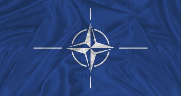 Flag of NATO with cloth texture. Close up of NATO flag waving