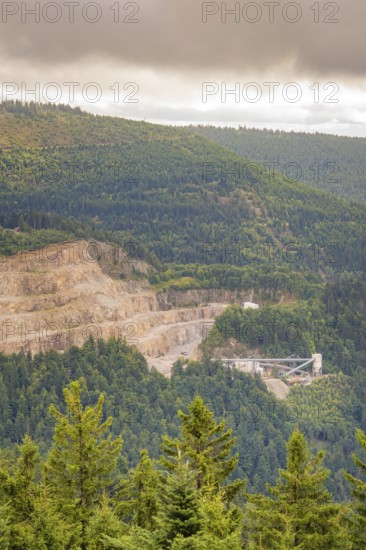 A quarry on a wooded hillside under a grey sky, Black Forest, Seebach, Germany