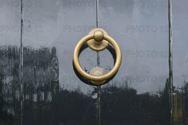 Door knocker on a black front door, Province of Groningen, Netherlands