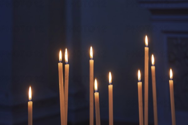 Sacrificial candles in a church, Tuscany, Italy