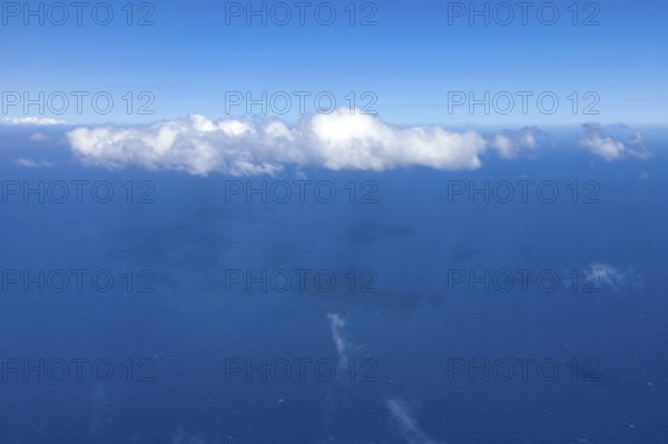View from aeroplane on white bright cluster cloud Altocumulus cloud, international