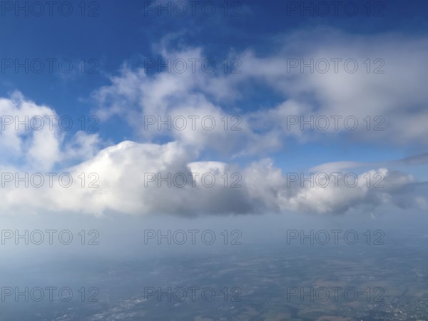 Aerial view of altocumulus clouds in the centre top centre cirrocumulus clouds cluster clouds, top right part of cirrostratus cloud high stratus cloud, international