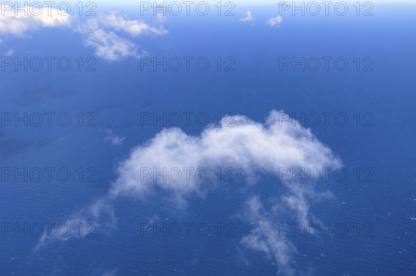 View from aeroplane of white bright cumulus clouds Cirrocumulus clouds Cirrocumulus at high altitude high clouds over the sea, international