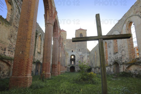Interior view of the St. Nikolai church ruins, cross, green lawn, nature, empty, twin towers, Zerbst, Fläming, Saxony-Anhalt, Germany