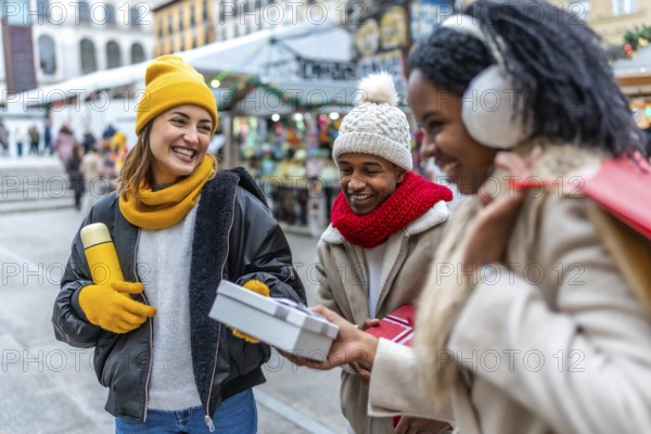 Multi ethnic friends exchanging gifts and smiling at a christmas market during wintertime