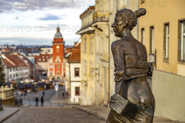 Bronze sculpture of Duchess Luise Dorothea of Saxe-Gotha-Altenburg in front of the main market square with the old town hall in Gotha, Thuringia, Germany