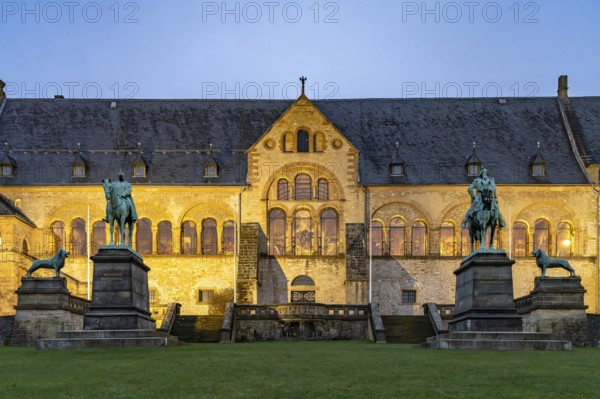 The Imperial House of the Romanesque Imperial Palace, UNESCO World Heritage Site in Goslar at dusk, Lower Saxony, Germany